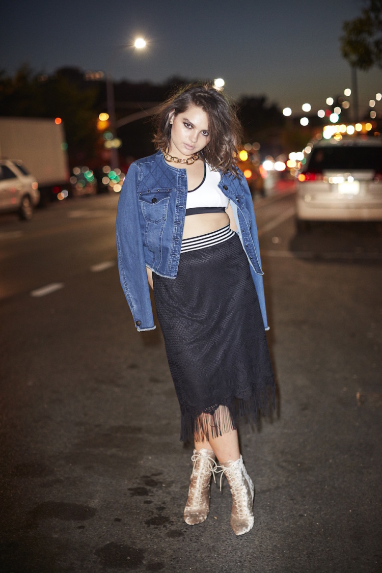 Denim Jacket and Skirt by 6th And Lane. Bra Top by Chromat. Boots by Public Desire. Choker by Jennifer Fisher. 
